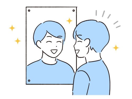 鏡の前で笑顔の練習をする男性教師