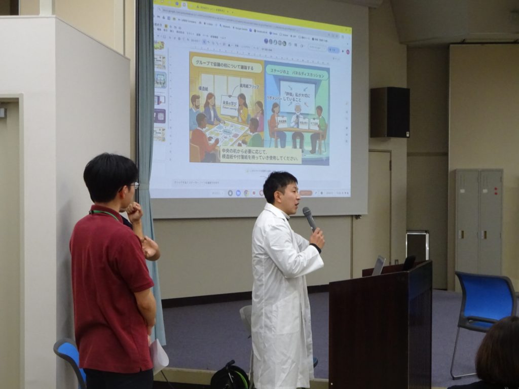 学び舎ゆめの森の発表や、参加者からの意見、田村先生の解説を基にしながら、参加者が主体的に対話し、思考を深めていくラボの概要を説明する事務局。