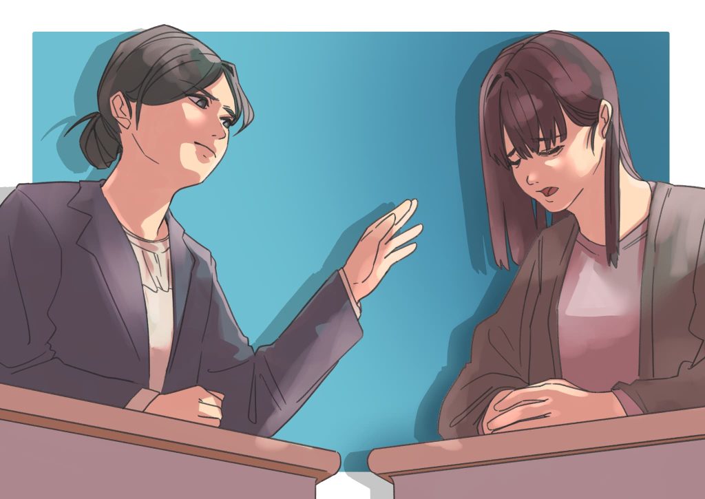 不安そうな保護者とそれを聞く教師